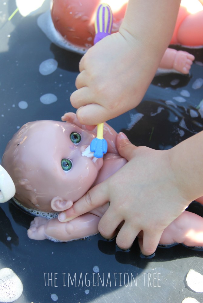 Brushing-baby-doll-teeth-water-play-activity-670x1000.jpg